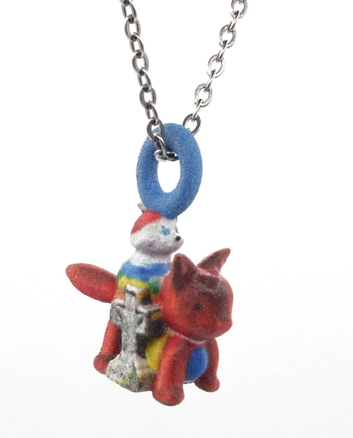 Amema charm necklace: red fox and striped cat beside a small stone cross
