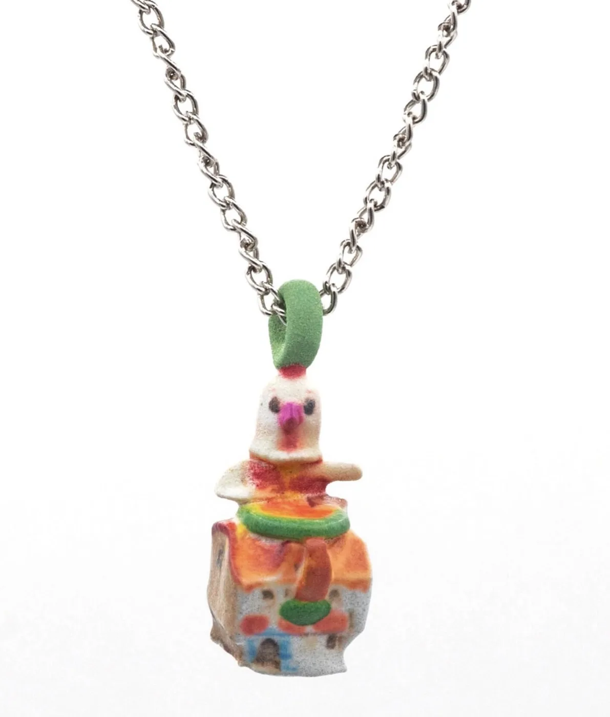 Amema charm necklace: chicken doll perched on a small printed house