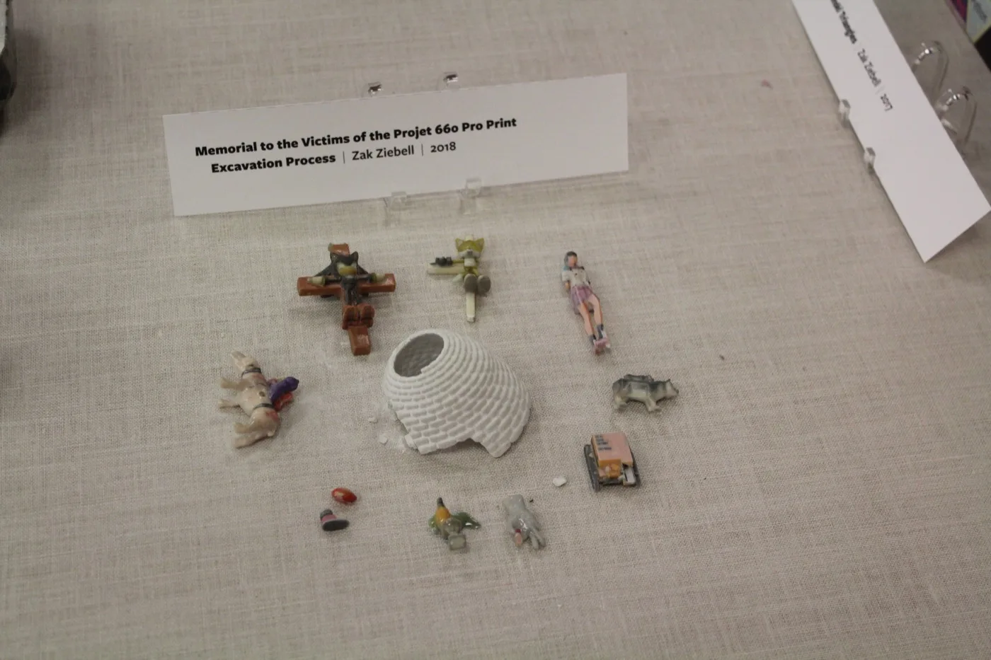 Boneyard of fragmented and broken gypsum charms from the print excavation process